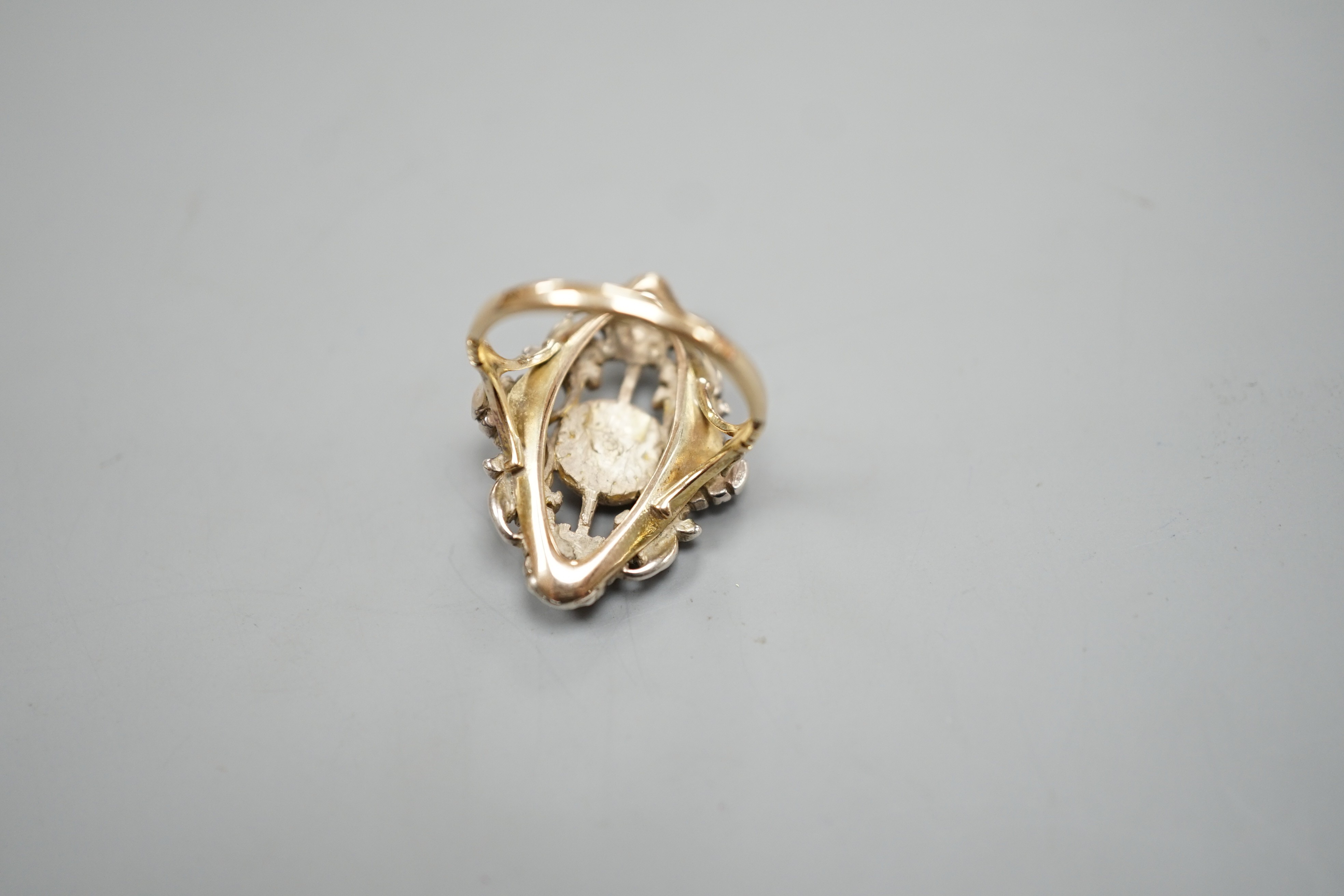 A pierced yellow and white metal, rose cut diamond cluster set ring (adapted?), size K, gross weight 6.1 grams.